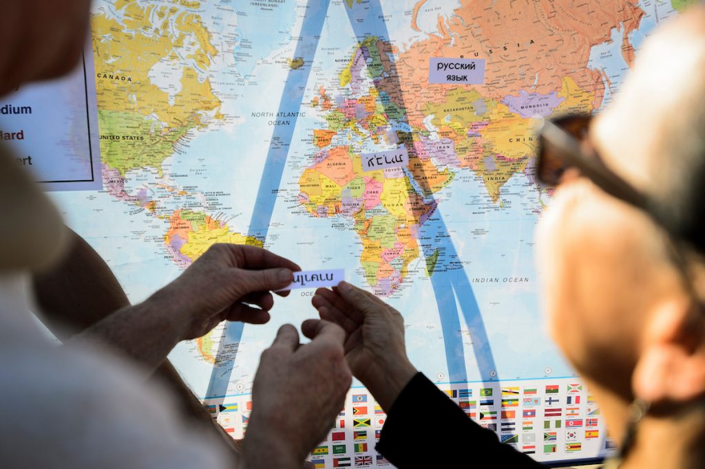 Two people looking at a map of the earth