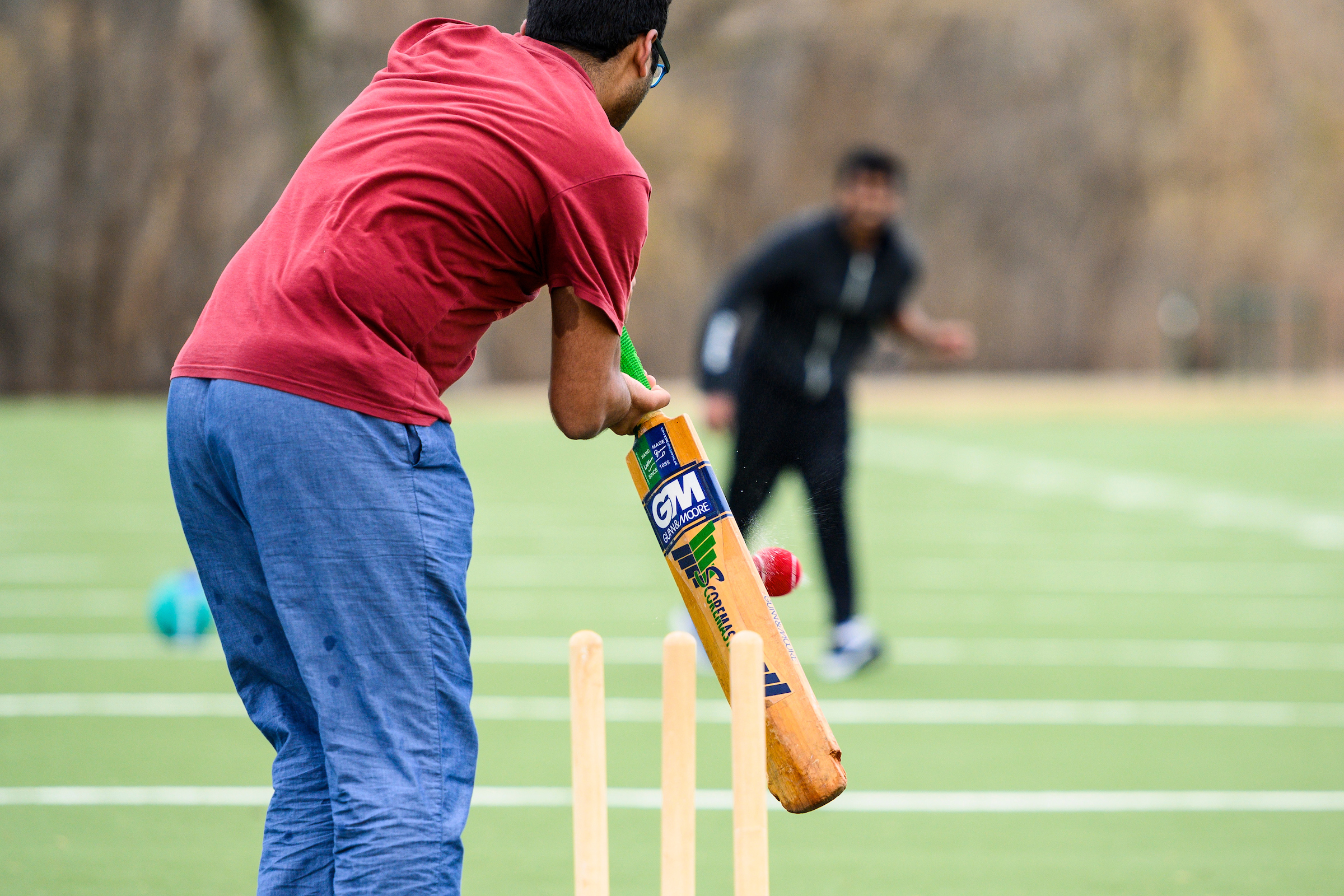 International students in a game of cricket.