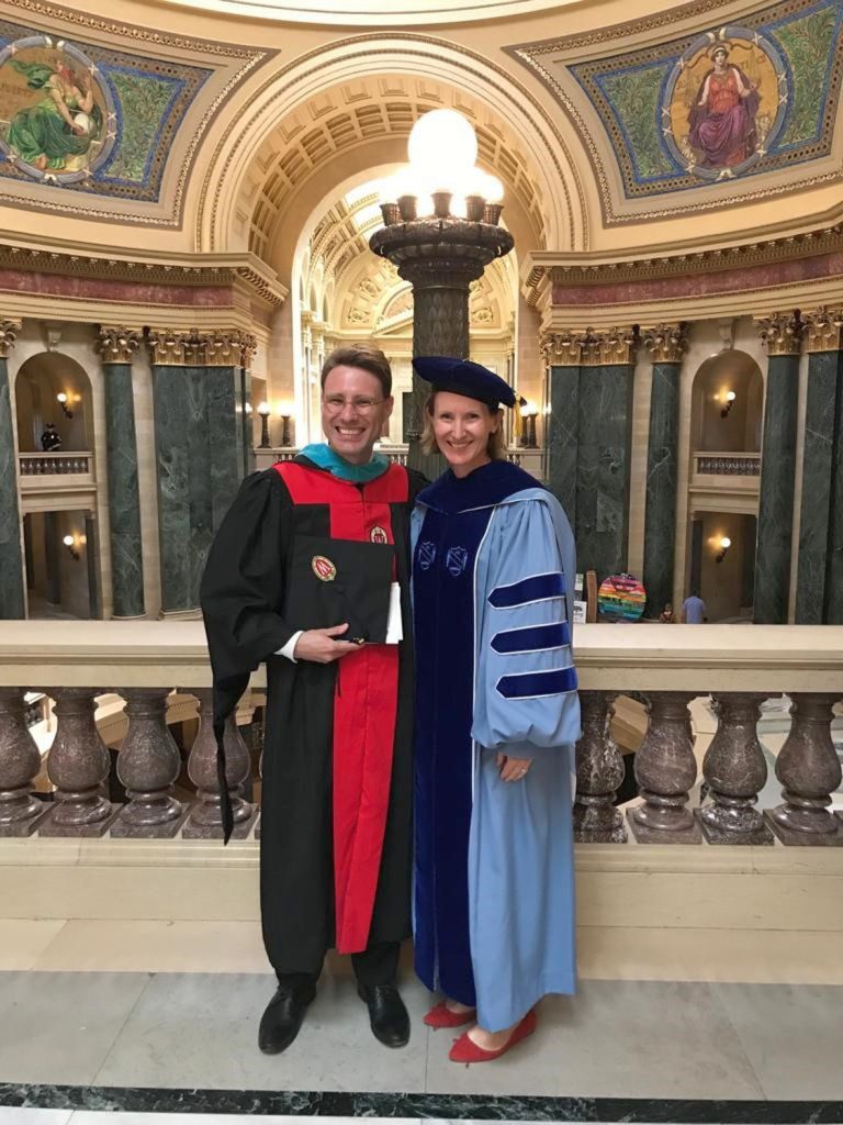 Graduate Jean Vilbert and Director Susan Yackee stand in the Wisconsin Capitol rotunda