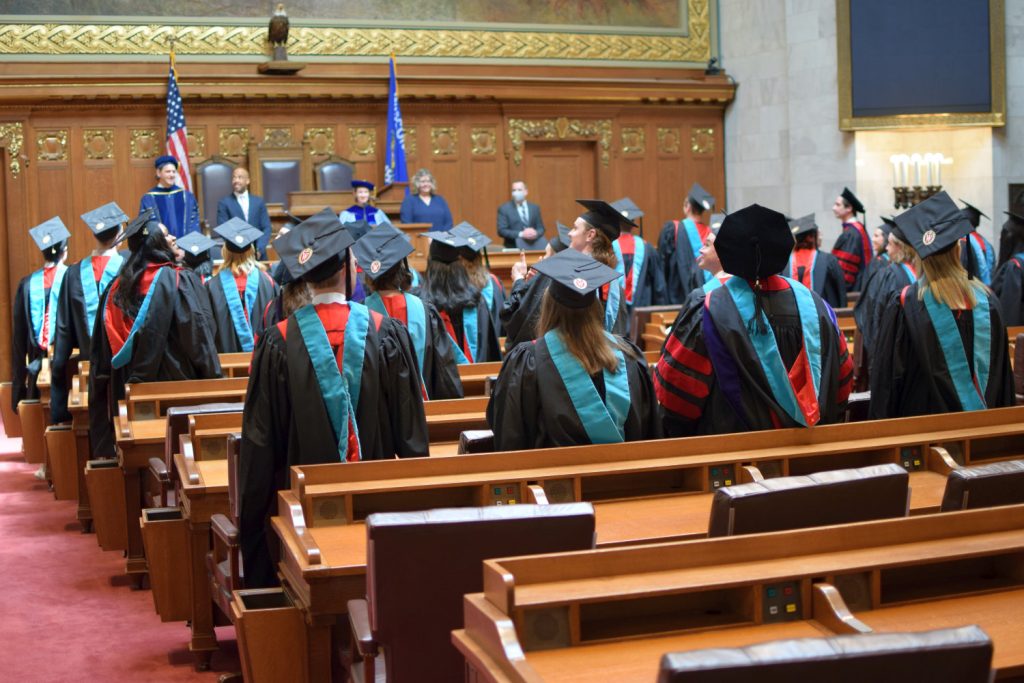 Graduates acknowledge the audience following the ceremony