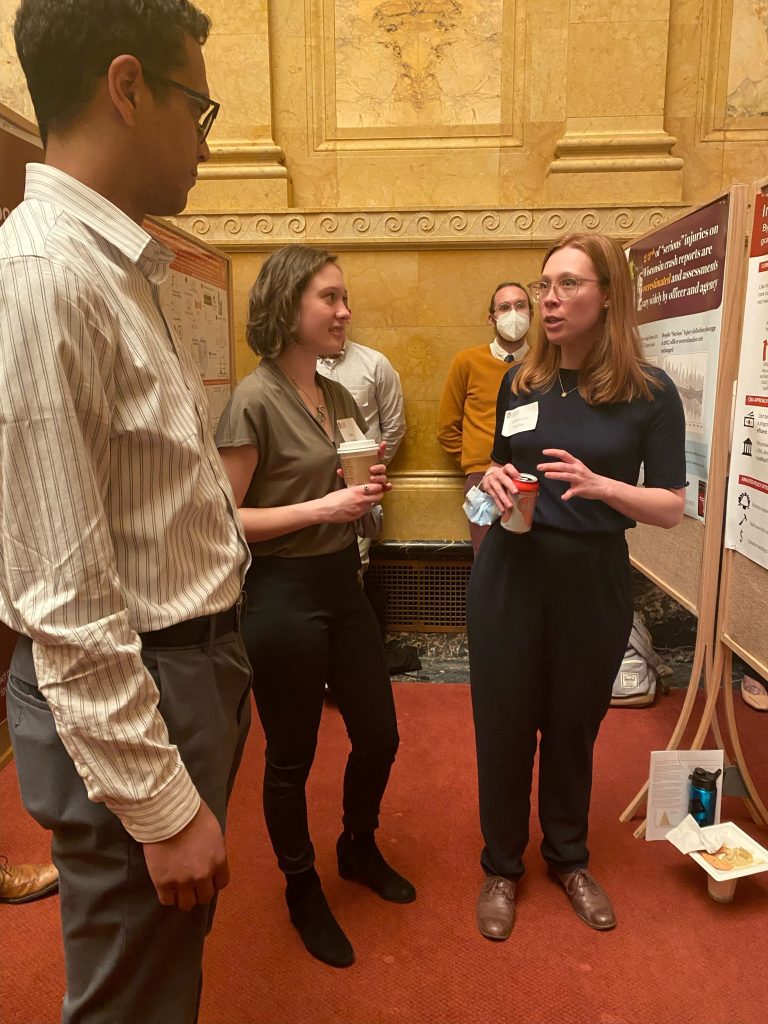 Genevieve Caffrey explains the team’s findings on policy alternatives to increase equitable child care access in La Crosse County to Legislative Assistant Colin Barushok.