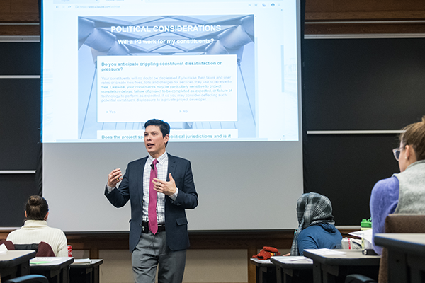 Professor Manny Teodoro addresses a class of students during a lecture.