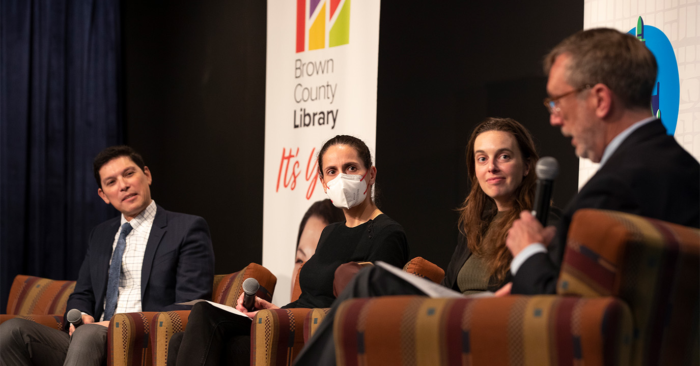 David Haynes addresses Manny Teodoro, Sarah Halpern-Meekin, and Morgan Edwards in Green Bay, WI.