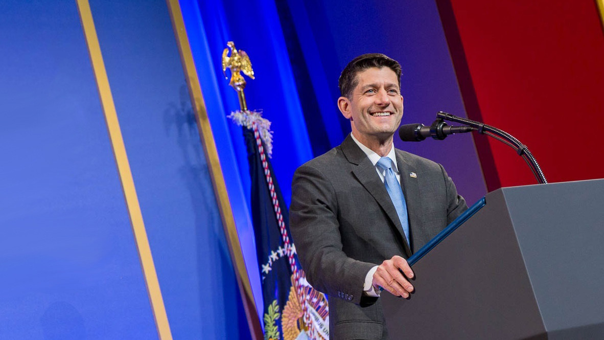 Former Speaker Paul Ryan speaking at podium