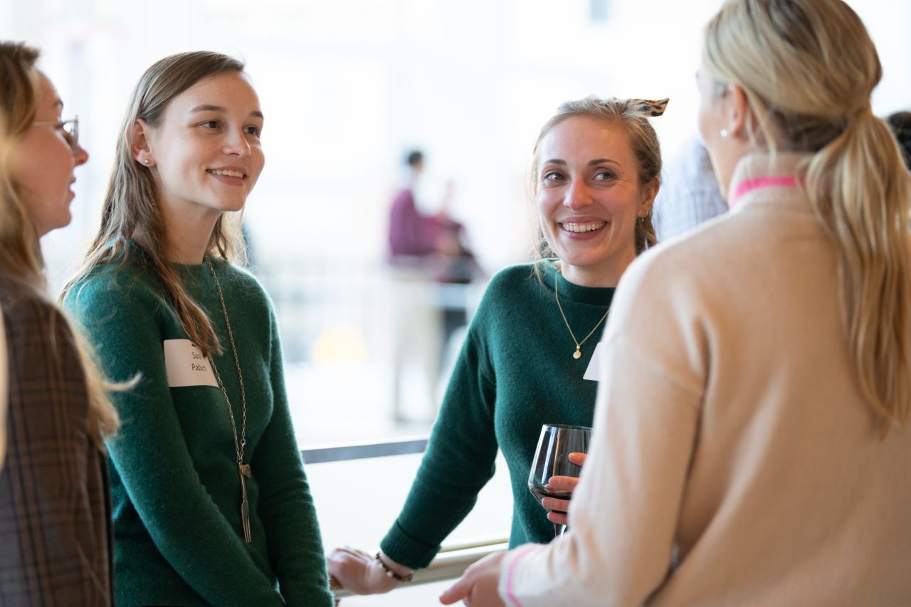 Alumni chat during a reception