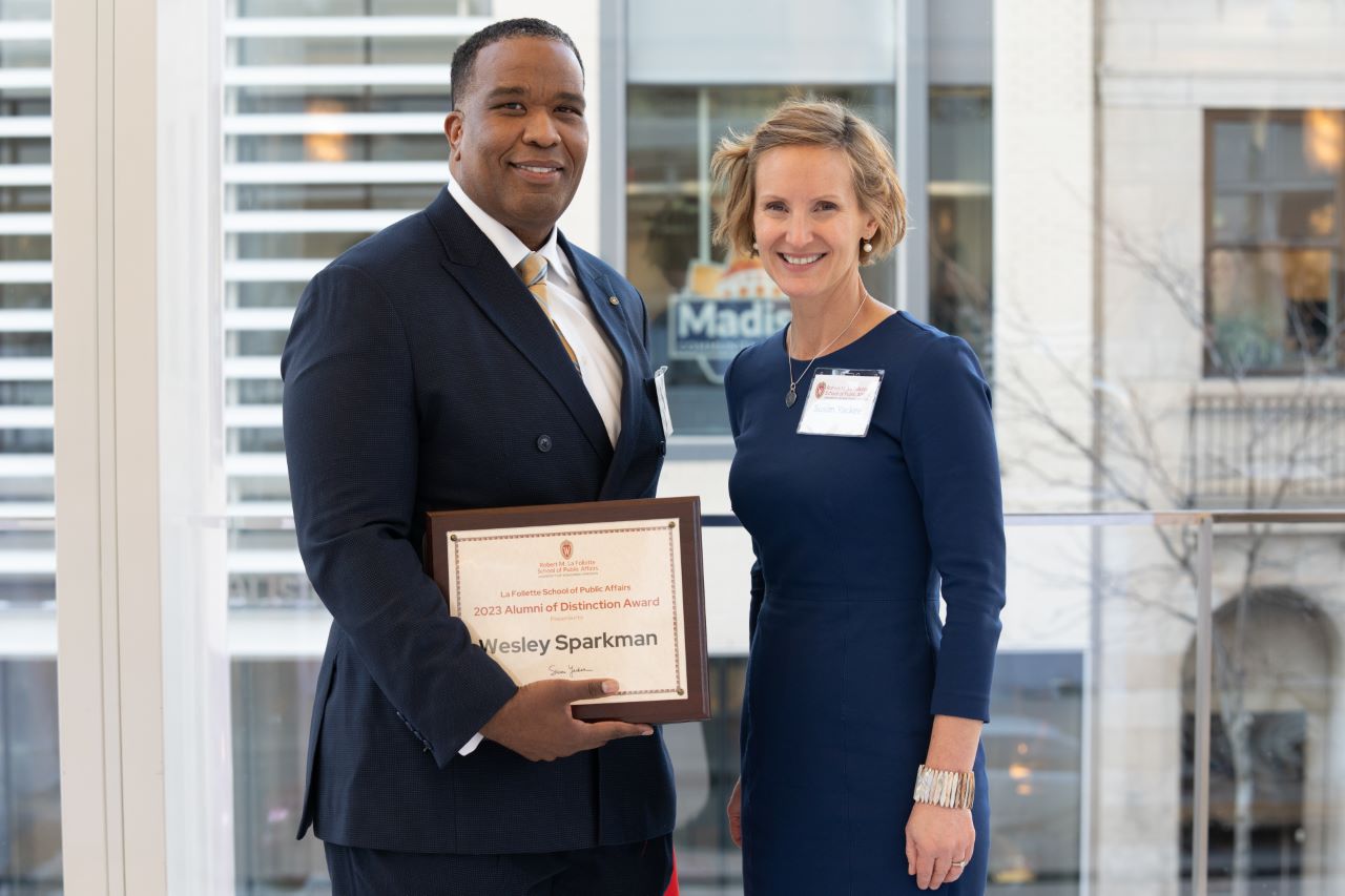 Wesley Sparkman holds a certificate while posing for a photo with Susan Yackee