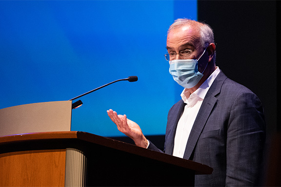 David Brooks speaks at a podium