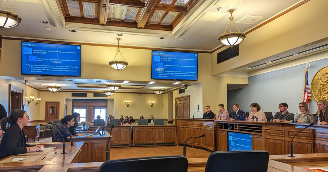 Students present to Wisconsin State Assembly staff in the capitol