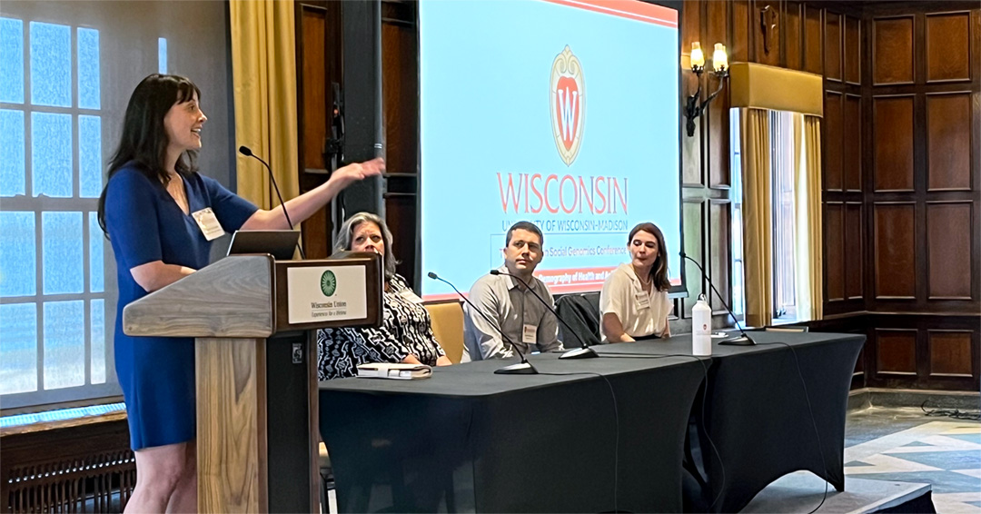 Assistant Professor Lauren Schmitz speaks at a podium in the university's Memorial Union.