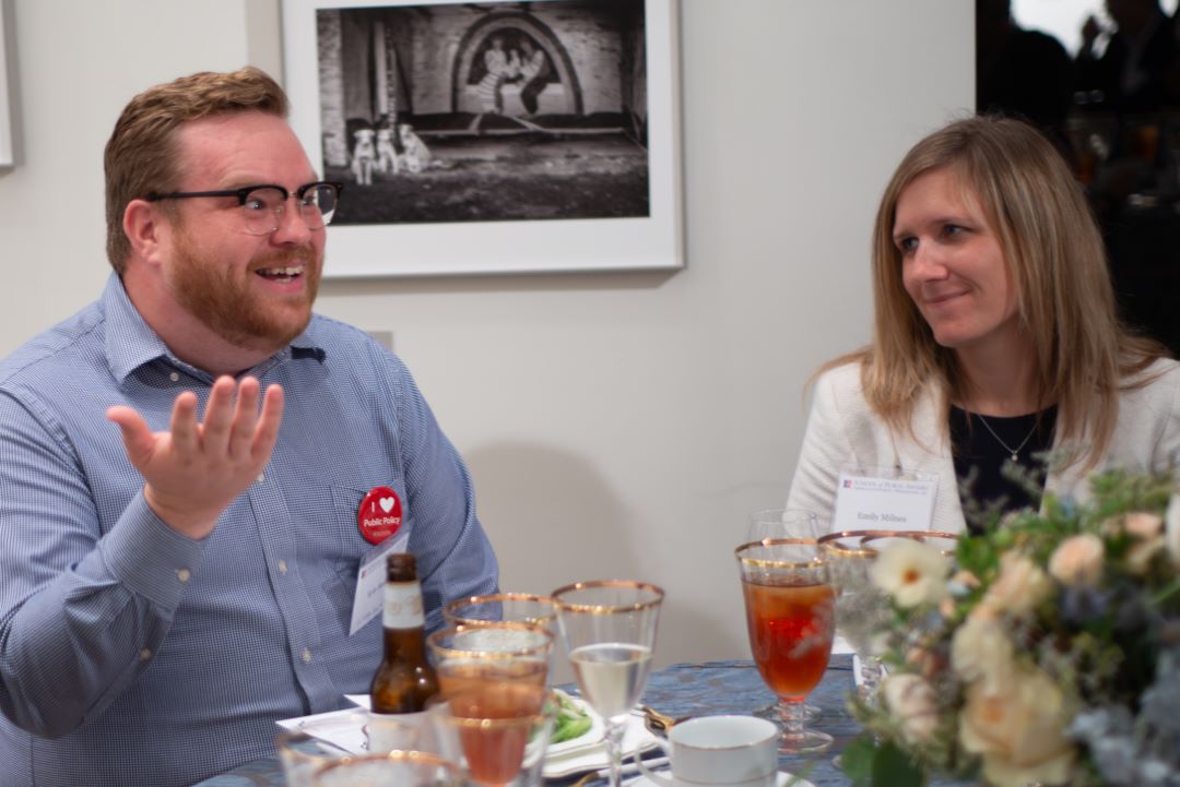 Alum Kyle Stanley and another participant talking