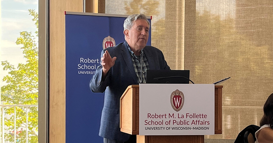 Professor Emeritus Tim Smeeding speaks at a podium