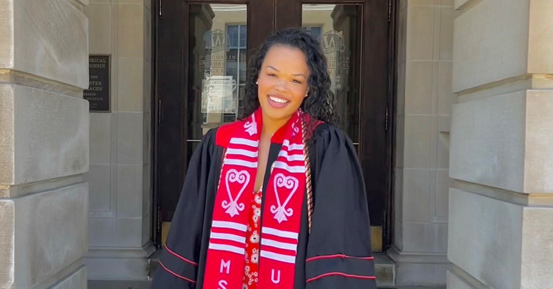 Portrait of Mia Williams wearing a graduation cap and gown.