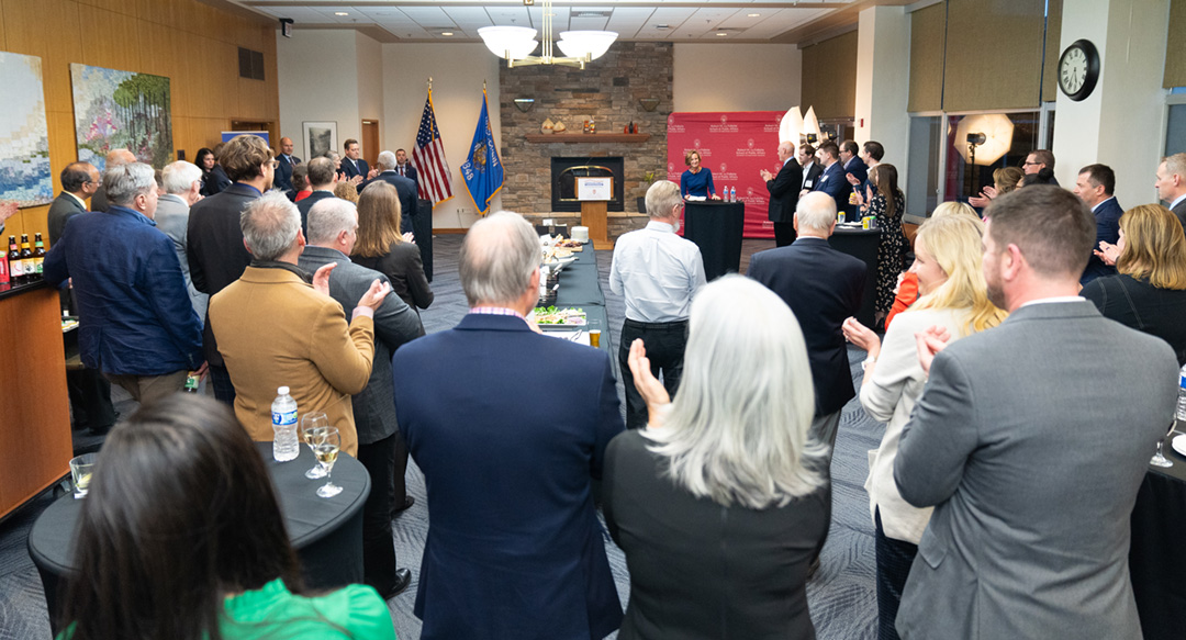 An audience applauds during a reception in the Pyle Center.