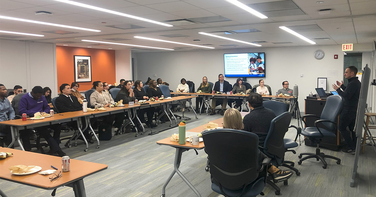 Students listen to a presentation at the American Institutes for Research