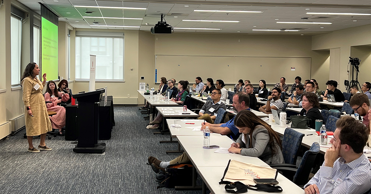 Speaker presents to a room of people