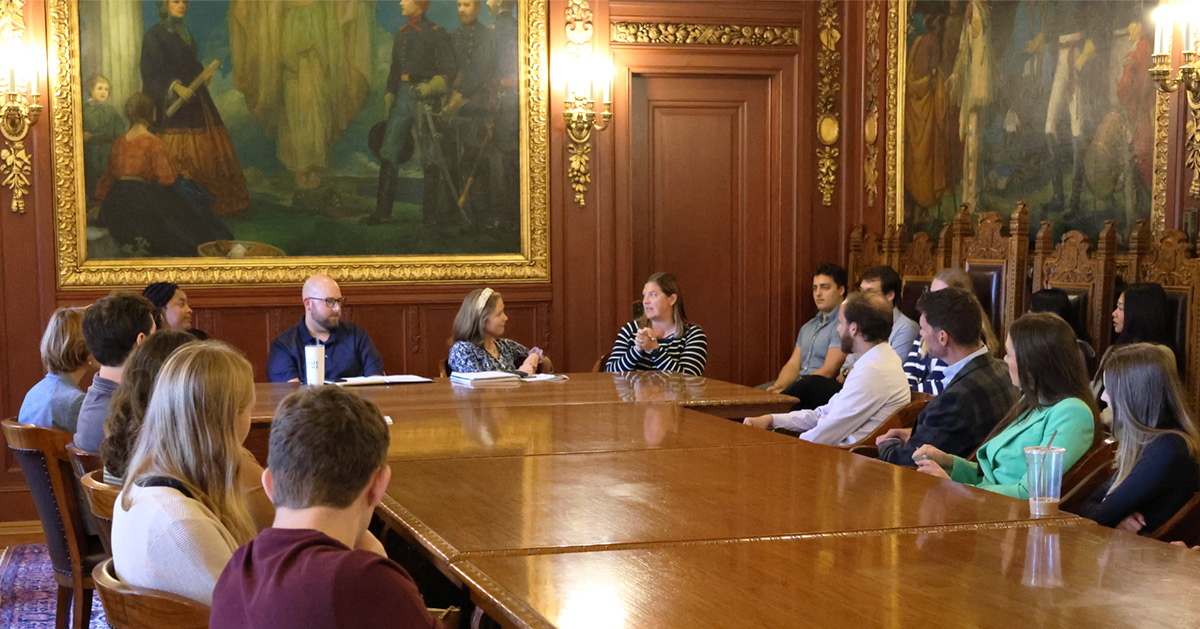 Students listen to a presentation from staff from the Wisconsin Governor's Office.