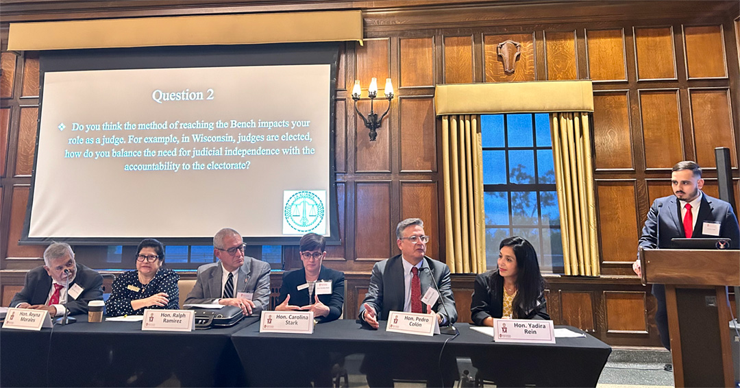 Carlos Puga moderates a discussion with Latino judges.