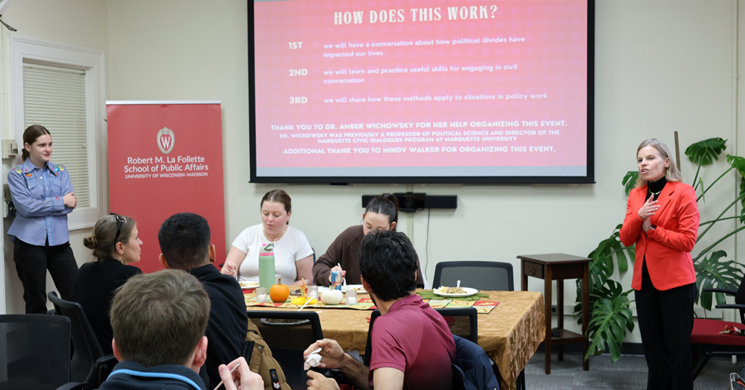 Amber Wichowsky speaks to participants during the How to Survive Thanksgiving event.