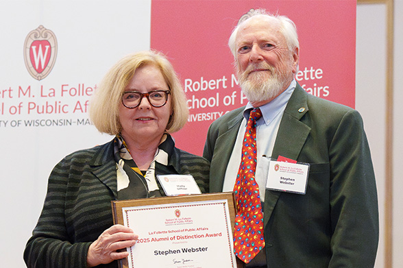 Molly Collins-Offner presents a plaque to Steven Webster