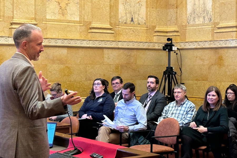 J. Michael Collins speaks to an audience at the capitol.