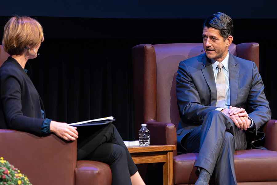 Paul Ryan speaks to Susan Yackee during an event.