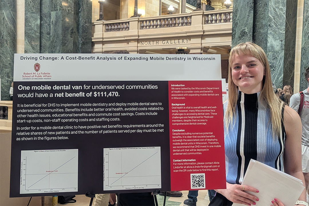 A student presents a poster at the Wisconsin State Capitol