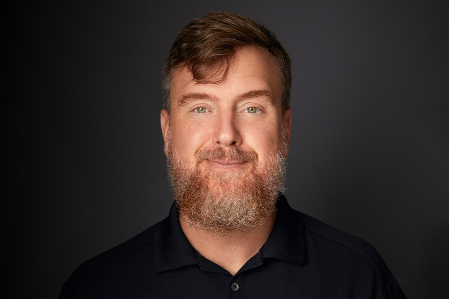 Professional headshot of Greg Lukianoff smiling at the camera.