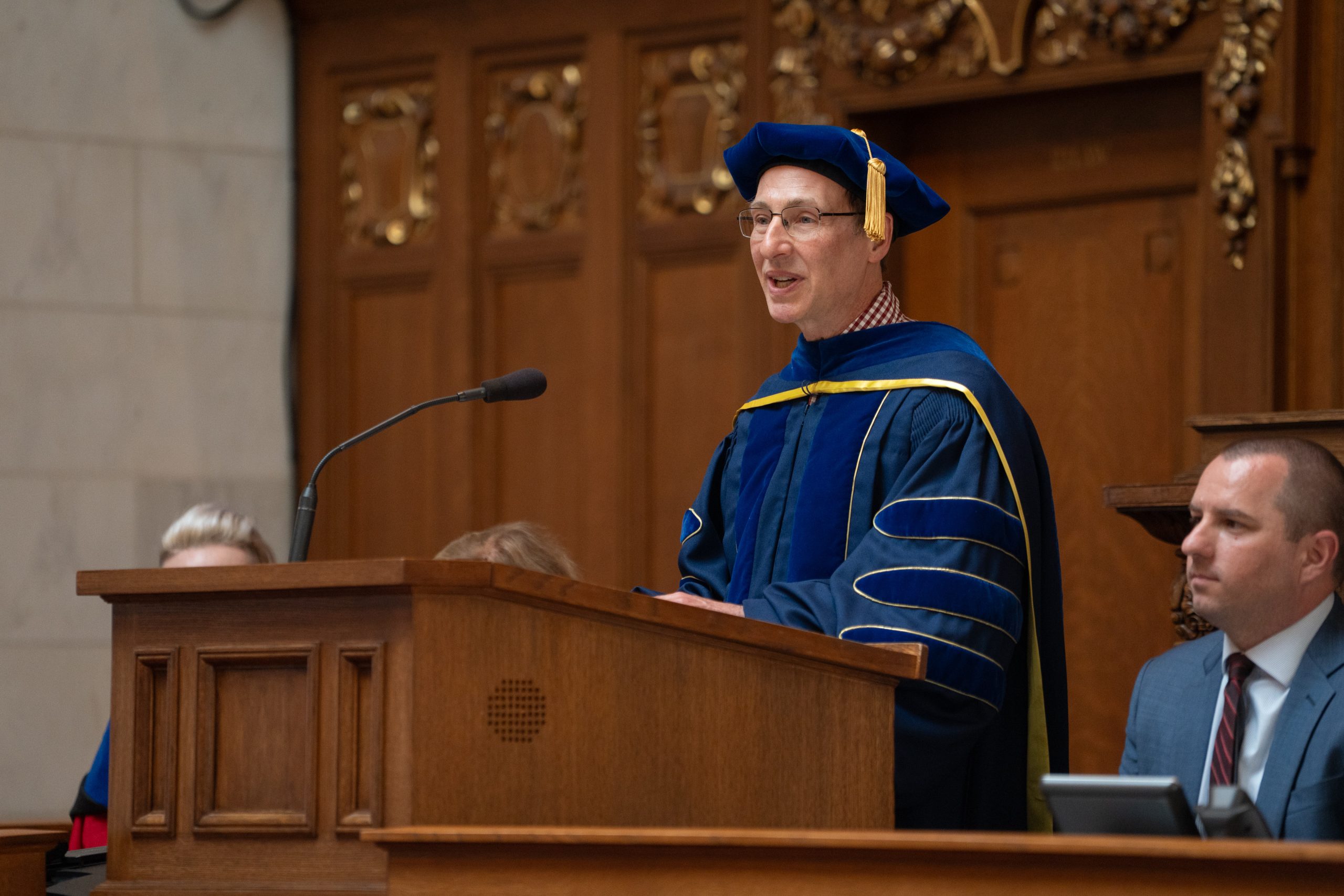 Master of ceremonies Jason Delborne speaks at podium