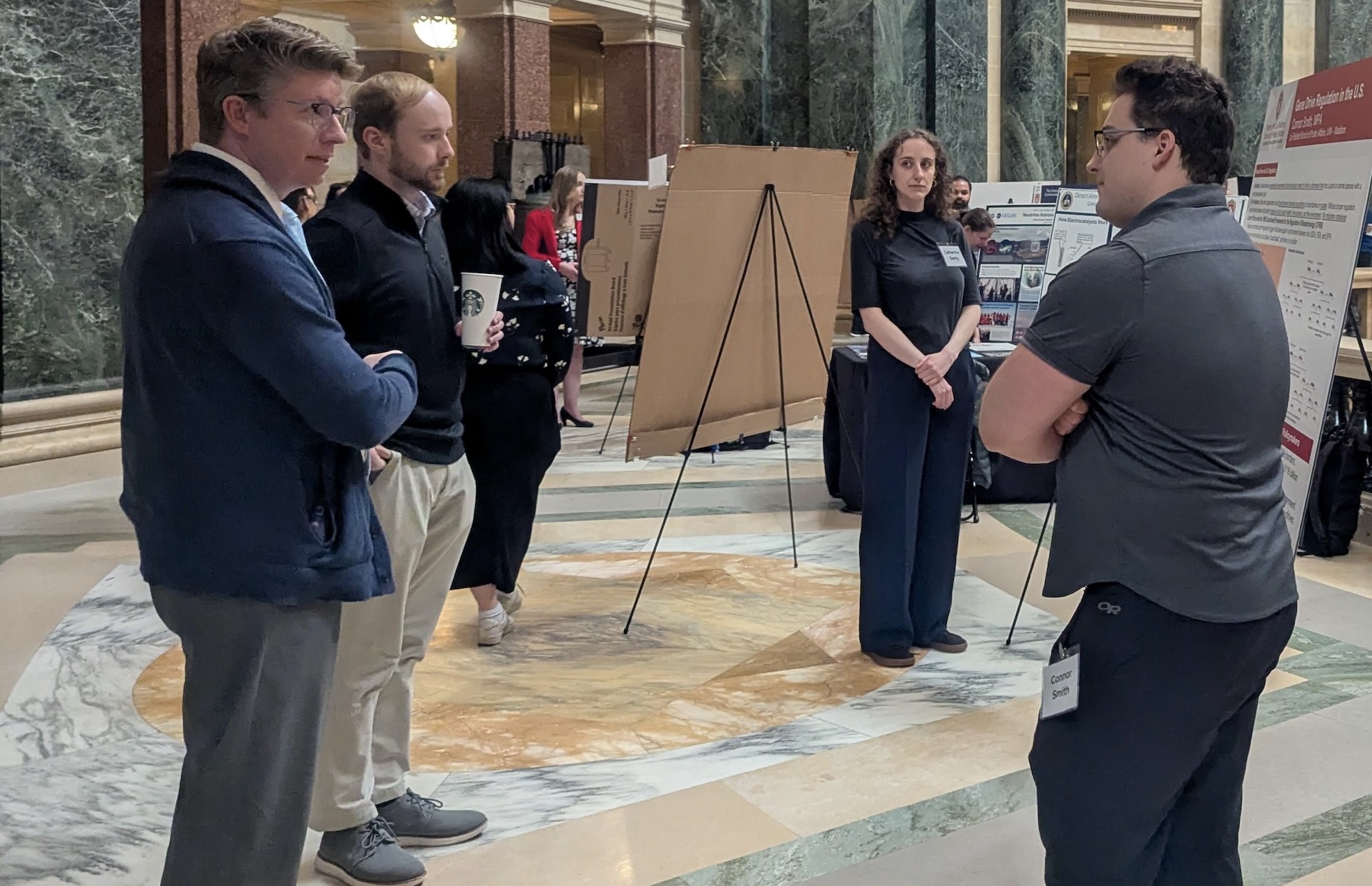 LFS student Connor Smith explains his research to legislative staff.