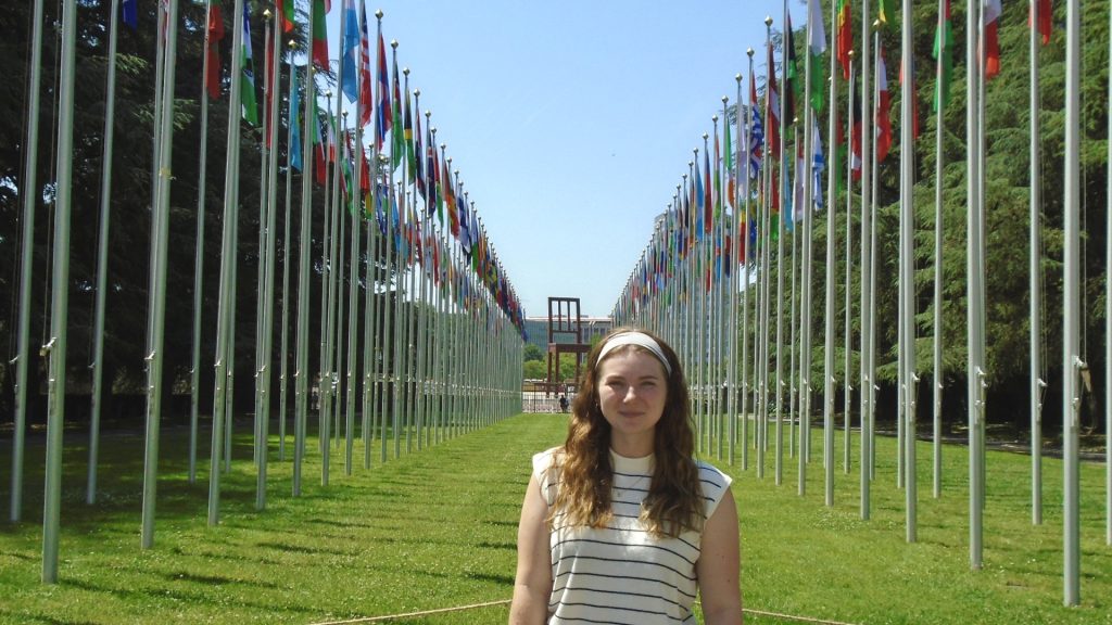 Ella smiling in front of her office.