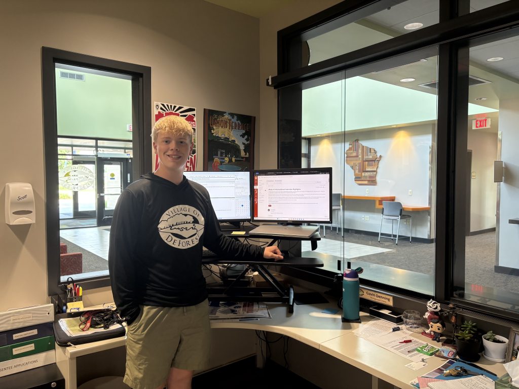 Gavin smiling in his office.