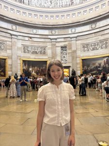 Samantha Dombar smiling in the rotunda. 