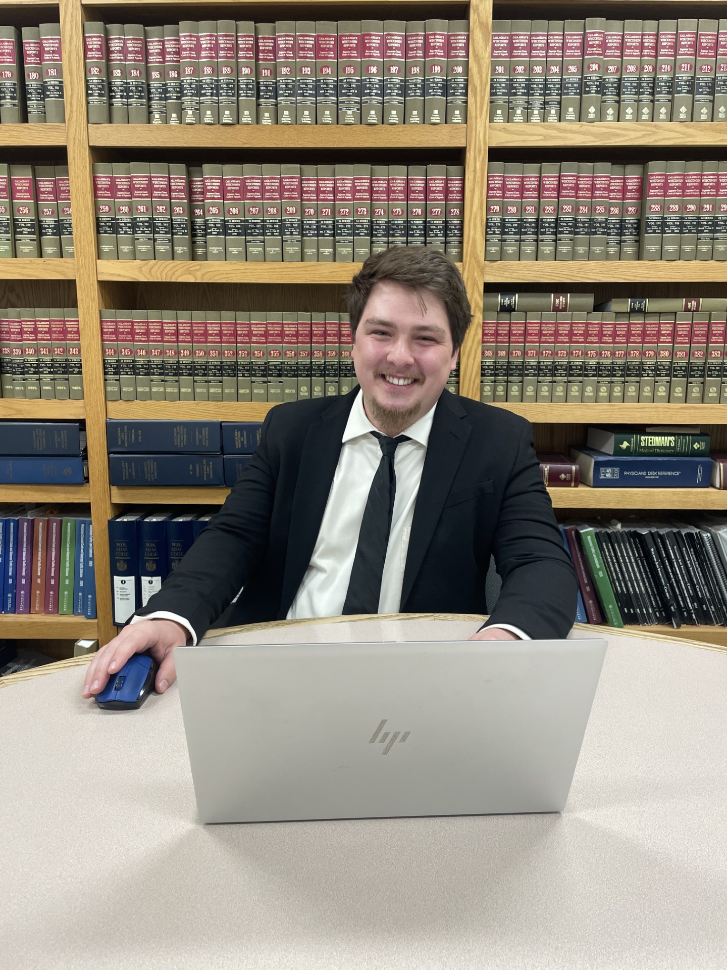 Andrew smiling in his office.
